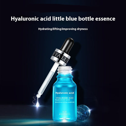 Blue bottle of hyaluronic acid essence with dropper on a dark background